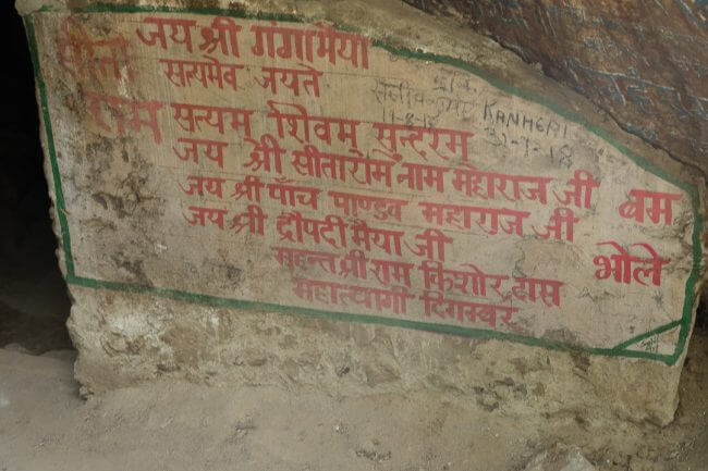 hindi script on cave entranve