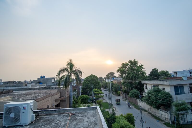 orange and blue sunset from a roof in Lahore, Pakistan